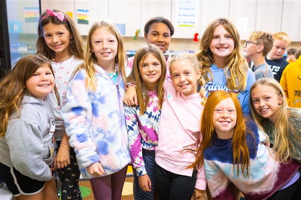 Students inside their classrooms learning. 